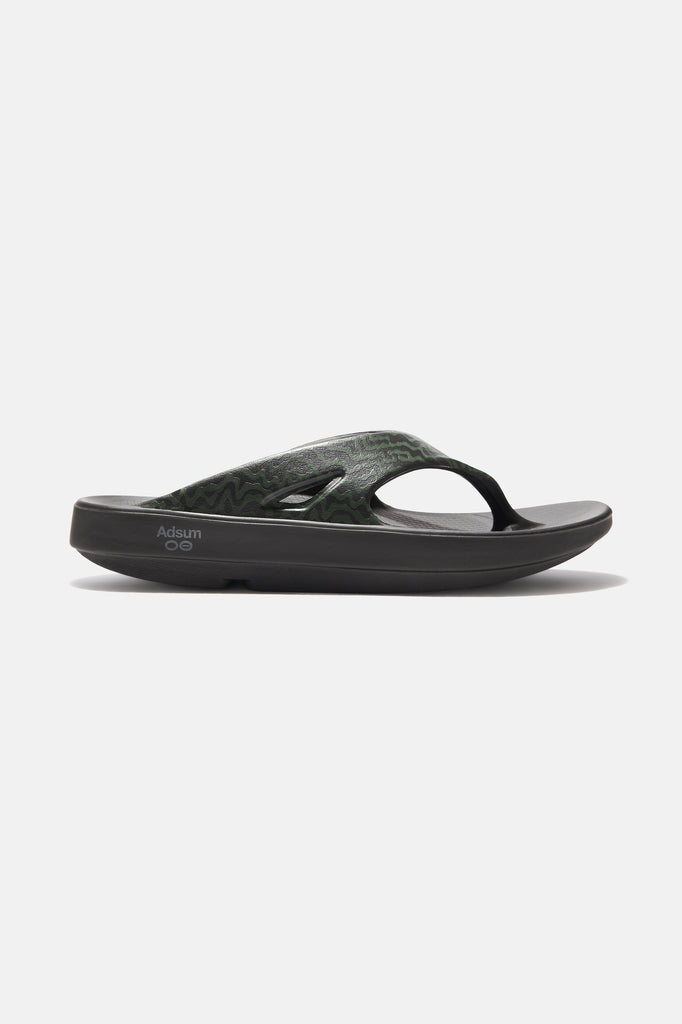 Adsum + OOFOS Sand Hopper, side profile showing matte mackerel-print strap and metallic Adsum logo